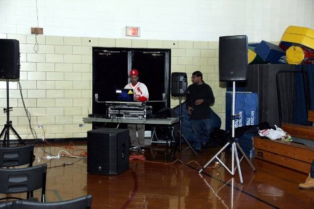DJ and assistant setting up.