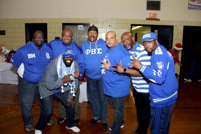 Group of men in blue attire