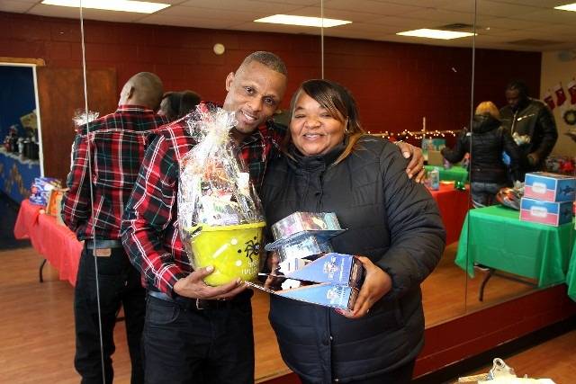 People holding gifts.