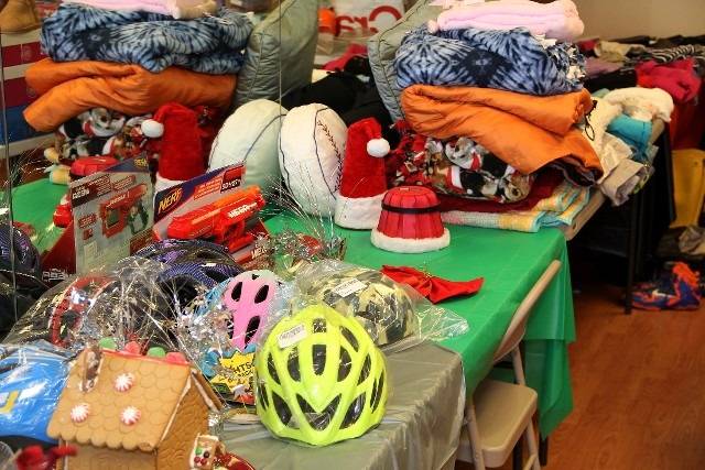 Gifts and various accessories on a green table.